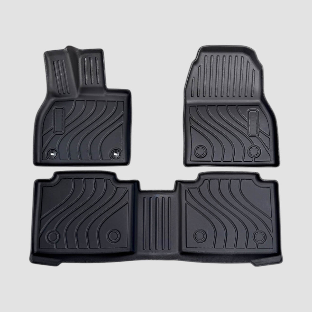All-weather matten set voor Toyota bZ4X, zwarte rubberen matten met patroon, getoond op een grijze achtergrond.