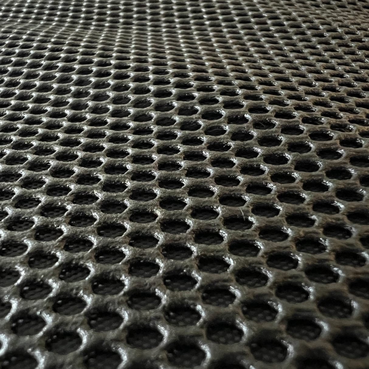 Inzoomen op de stof van de autostoelbeschermer