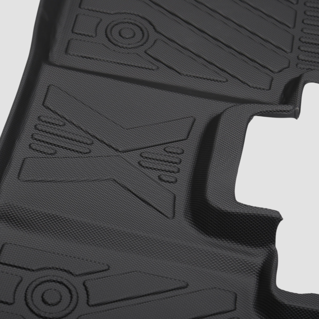 Close-up van een zwarte 3D allweather rubberen automat met patroon