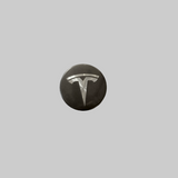 Mat zwarte middenkap met zilveren Tesla-logo