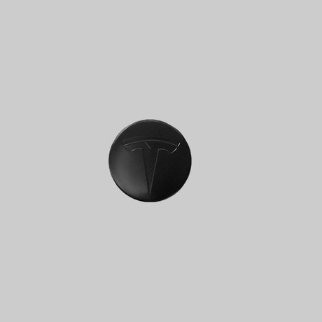 Centrumsdop met een zwart Tesla-logo